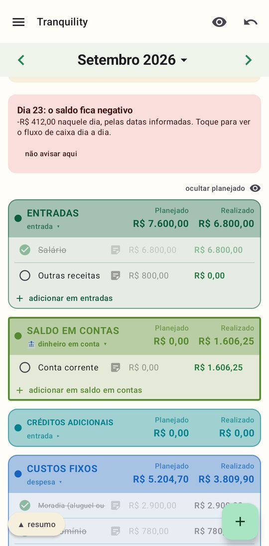 A tabela do mês no Tranquility: entradas, saldo em contas e custos fixos, com as colunas planejado e realizado.